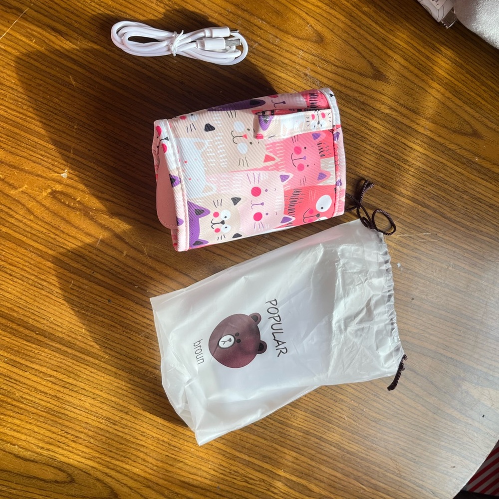 Pink Portable baby bottle warmer with USB cord never used
